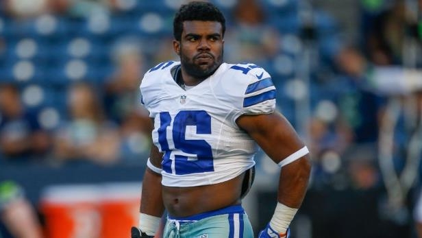 seattle-wa-august-25-running-back-ezekiel-elliott-21-of-the-dallas-cowboys-looks-on-prior-to-the-pre_298094_